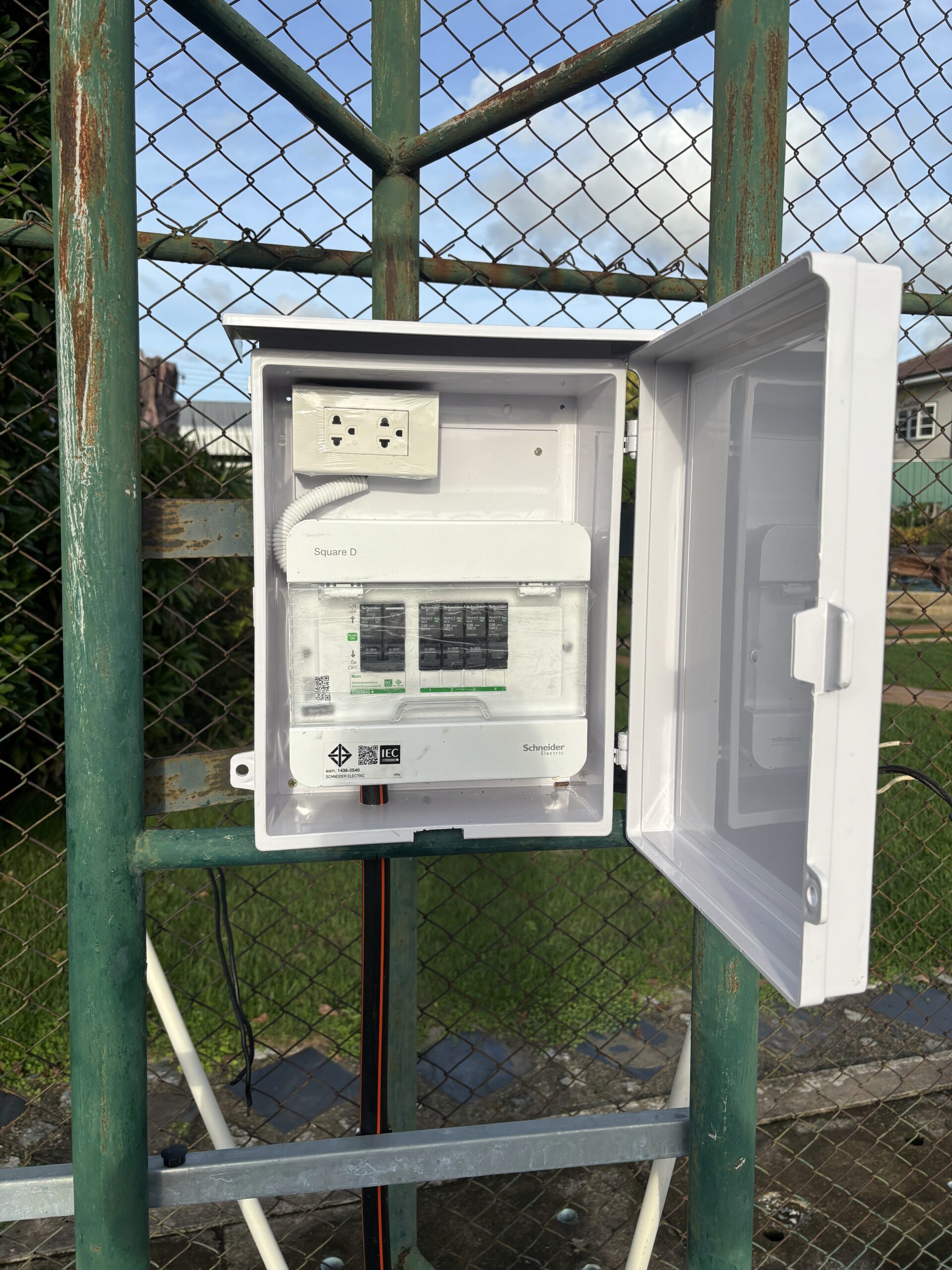 Upgraded IP-rated weatherproof outdoor electrical distribution board installed on steel post mount by ACES Pattaya