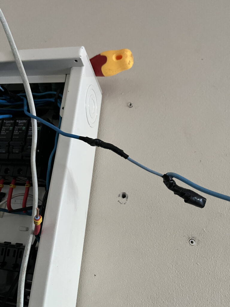 Dangerous 1.5 sqmm cable bottleneck spliced between 2.5 sqmm wires with electrical tape.