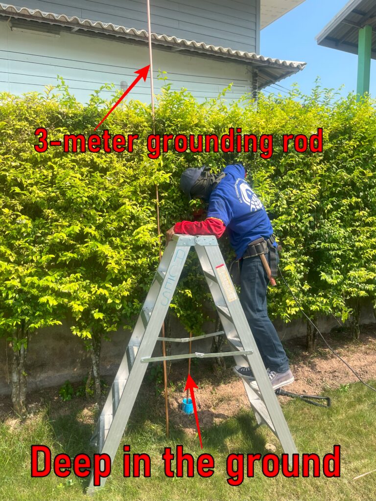 ACES Pattaya electrical technician installing a deep copper earth grounding rod into the soil for residential electrical safety