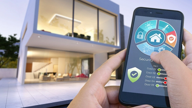 Hand holding a smartphone using a smart home automation app to control lighting and electrical systems in a modern luxury villa by ACES Pattaya