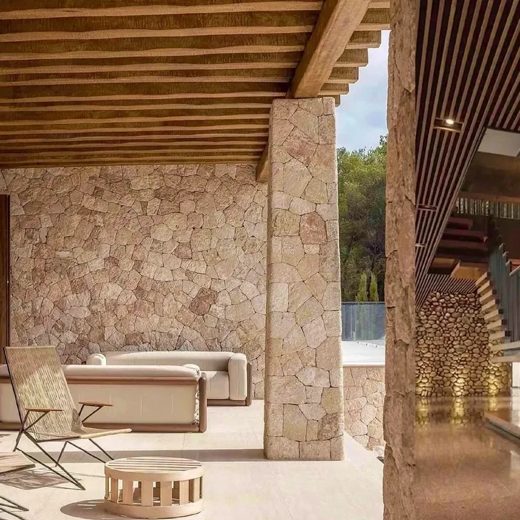 ACES Pattaya luxury outdoor patio construction featuring natural stone clad pillars, timber ceiling beams, and integrated architectural lighting