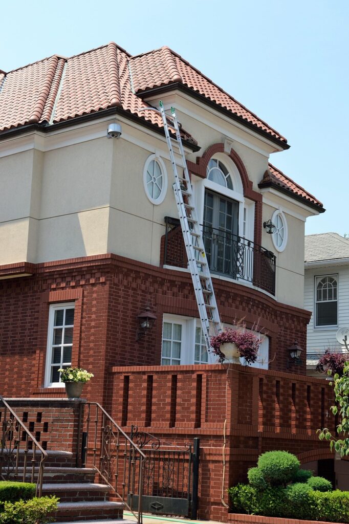 Extension ladder and security camera installed on a two-story residential building