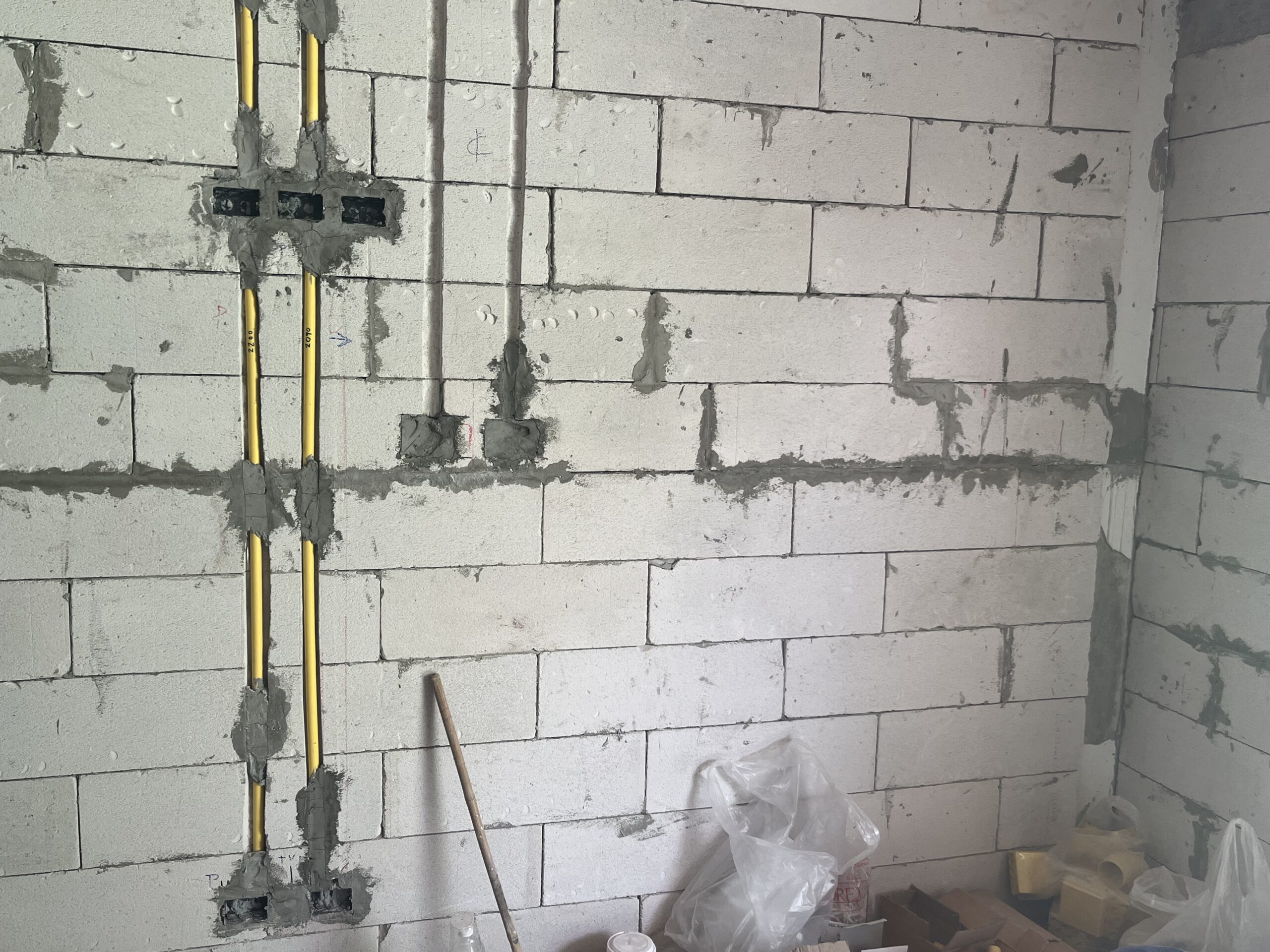 In-wall rigid conduit chasing and switch box installation in AAC block wall Pattaya